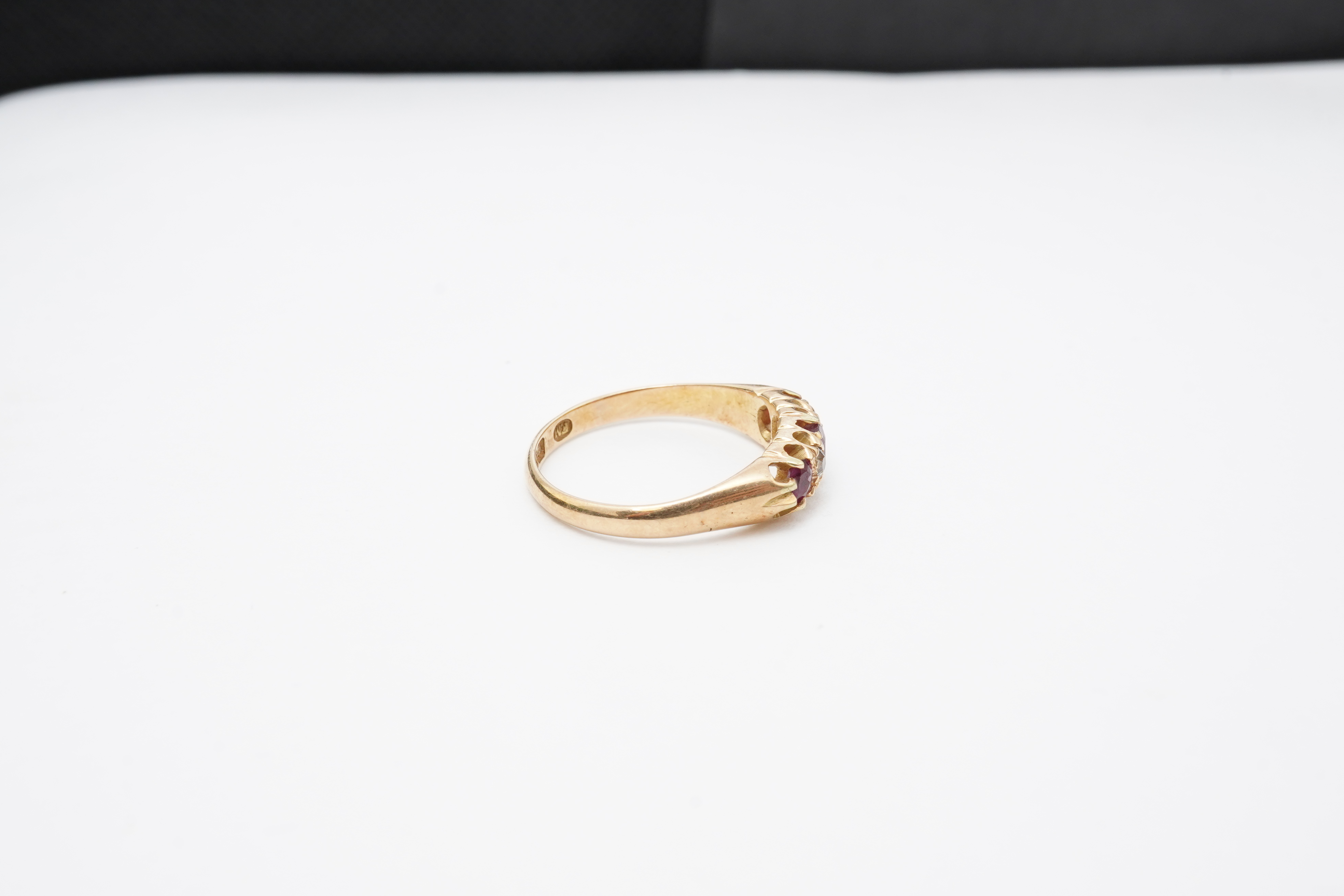 A ruby and diamond five-stone ring, circa 1900